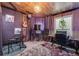 This music room features dark walls, a faux wood ceiling, curtains, and various instruments for a great vibe at 5280 Genoa St, Denver, CO 80249