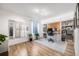 This bright home office features wood floors, lots of natural light, storage, and room for plants at 5280 Genoa St, Denver, CO 80249