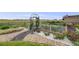 Backyard raised garden beds with healthy vegetation, providing a charming and sustainable feature to the property at 5280 Genoa St, Denver, CO 80249