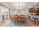 Inviting dining room with natural light, a chandelier, and easy access to the kitchen at 23941 E Whitaker Dr, Aurora, CO 80016