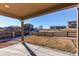 Covered patio overlooking grassy backyard at 9685 Bellaire Ln, Thornton, CO 80229