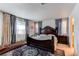 Large bedroom with a king-size bed and dresser at 9685 Bellaire Ln, Thornton, CO 80229