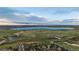 Spacious lot features green space, a lake, and neighborhood views from above at 5227 S Geneva St, Englewood, CO 80111