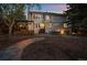 Landscaped backyard with outdoor kitchen, fire pit, patio, and exterior elevation at 5227 S Geneva St, Englewood, CO 80111