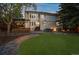 Expansive backyard featuring an outdoor bar, dining area, and fire pit at 5227 S Geneva St, Englewood, CO 80111