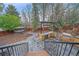Backyard oasis with hot tub, outdoor kitchen, grill, stone pavers, and landscape at 5227 S Geneva St, Englewood, CO 80111