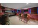 Finished basement featuring a bar area, seating, and a media room at 5227 S Geneva St, Englewood, CO 80111