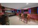 Basement featuring a home theater with a projector, a wet bar, and cozy seating, ideal for movie nights at 5227 S Geneva St, Englewood, CO 80111