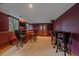 Basement featuring a wet bar, a TV, and a table, ideal for entertaining guests at 5227 S Geneva St, Englewood, CO 80111