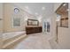 Spacious bathroom with a large vanity, walk-in shower, and separate soaking tub at 5227 S Geneva St, Englewood, CO 80111