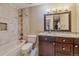 Well-lit bathroom with updated vanity, bathtub, and modern fixtures at 5227 S Geneva St, Englewood, CO 80111