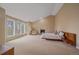 Bright bedroom featuring large windows, fireplace, and modern platform bed at 5227 S Geneva St, Englewood, CO 80111