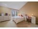 Cozy bedroom featuring neutral colors, a desk, and a large window at 5227 S Geneva St, Englewood, CO 80111