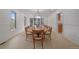 Formal dining room featuring a large dining table and ample natural light at 5227 S Geneva St, Englewood, CO 80111