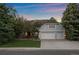 Beautiful two-story home featuring a two-car garage and well-manicured lawn at 5227 S Geneva St, Englewood, CO 80111