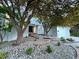 Beautifully landscaped front yard with stone steps leading to the entrance, enhancing the curb appeal at 5227 S Geneva St, Englewood, CO 80111