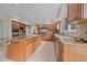 Spacious kitchen with stainless steel appliances, a large island, and granite countertops at 5227 S Geneva St, Englewood, CO 80111