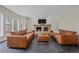 Living room with a fireplace, comfortable sofas, slate floors and lots of light at 5227 S Geneva St, Englewood, CO 80111