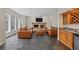 Cozy living room with a stone fireplace, hardwood floors, and bar area at 5227 S Geneva St, Englewood, CO 80111