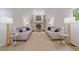 Open living room with high vaulted ceiling, fireplace, and ample seating at 5227 S Geneva St, Englewood, CO 80111