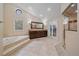 Spacious main bathroom with a soaking tub, walk-in shower, and double vanity at 5227 S Geneva St, Englewood, CO 80111