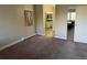 View of the bedroom featuring neutral walls, a large window, and a door to the bathroom at 13601 E Marina Dr # 510, Aurora, CO 80014