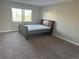 Bedroom with a queen-size bed, carpeted floor, and a window with natural light at 13601 E Marina Dr # 510, Aurora, CO 80014