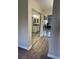 Hallway featuring mirrored closet doors leading to the bathroom and bedroom at 13601 E Marina Dr # 510, Aurora, CO 80014