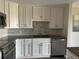 Kitchen featuring modern white cabinets, stainless appliances, and granite counters at 13601 E Marina Dr # 510, Aurora, CO 80014
