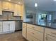 Bright kitchen with a large island featuring drawers, cabinets and sleek countertops at 13601 E Marina Dr # 510, Aurora, CO 80014