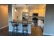 Bright kitchen features stainless steel appliances, white cabinets, and a breakfast bar with seating at 13601 E Marina Dr # 510, Aurora, CO 80014