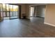 Spacious living room with hardwood floors and sliding glass doors to a balcony at 13601 E Marina Dr # 510, Aurora, CO 80014