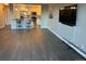 Open-concept living space with hardwood floors connecting to a kitchen with modern appliances at 13601 E Marina Dr # 510, Aurora, CO 80014