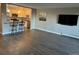 Open concept living room and updated kitchen with breakfast bar seating at 13601 E Marina Dr # 510, Aurora, CO 80014