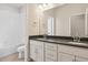 Bathroom featuring double vanity with dark countertop and an adjacent bathtub-shower combination at 13765 Emerald Lake St, Parker, CO 80138
