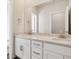 Bathroom featuring a double sink vanity, large mirror, and modern finishes at 13765 Emerald Lake St, Parker, CO 80138