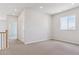Bright bedroom featuring neutral walls, plush carpet and a window offering natural light at 13765 Emerald Lake St, Parker, CO 80138