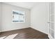 Well-lit bedroom features wood floors, white walls, and a large window at 13765 Emerald Lake St, Parker, CO 80138