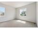 Spacious bedroom with two windows and neutral carpet at 13765 Emerald Lake St, Parker, CO 80138