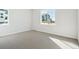 Spacious bedroom featuring large windows, neutral carpet, and white walls at 13765 Emerald Lake St, Parker, CO 80138