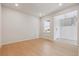 Minimalist interior of a modern living room showcasing neutral walls and hardwood floors at 13765 Emerald Lake St, Parker, CO 80138