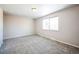 Bedroom with carpet, a window with natural light, and neutral paint at 245 Otis Ct, Lakewood, CO 80226