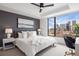 Comfortable bedroom with city views, modern décor, and stylish furniture accents at 1750 Wewatta St # 1304, Denver, CO 80202