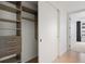 Walk-in closet featuring custom shelving and drawers for optimal organization and storage at 1750 Wewatta St # 1304, Denver, CO 80202