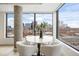 Cozy dining nook with stunning cityscape views and stylish, comfortable seating at 1750 Wewatta St # 1304, Denver, CO 80202