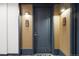 Condo entrance featuring a door with a blue frame and the unit numbers 1304 and 1313 on wall-mounted plates at 1750 Wewatta St # 1304, Denver, CO 80202