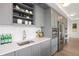 Bright kitchen boasts stainless appliances, sleek gray cabinets, and integrated microwave at 1750 Wewatta St # 1304, Denver, CO 80202