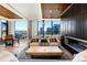 Well-appointed lounge with sleek furnishings, city views, and a cozy fireplace, perfect for relaxation at 1750 Wewatta St # 1304, Denver, CO 80202
