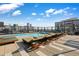 Inviting rooftop pool with lounge chairs and skyline views for relaxing and soaking up the sun at 1750 Wewatta St # 1304, Denver, CO 80202