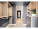 Well-organized walk-in closet boasting ample storage with drawers and shelves, leading to the bathroom at 1750 Wewatta St # 1304, Denver, CO 80202